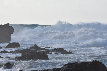 Watching the waves from the cliff