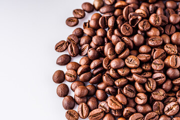 aromatic fresh coffee beans on a white acrylic background