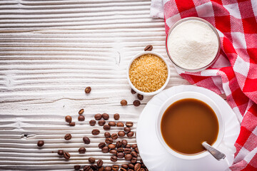 cup of fragrant fresh coffee on a white wooden rustic background