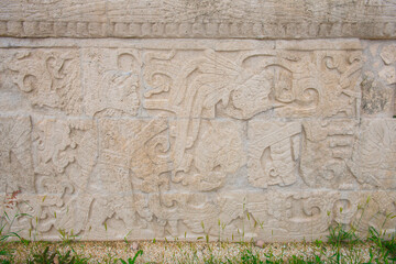 Stone carving at Juego de Pelota Ball Court at Chichen Itza archaeological site in Yucatan, Mexico. Chichen Itza is a UNESCO World Heritage Site.