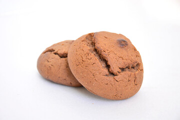 Oatmeal cookies close-up on a white background. Round biscuits close-up. Sweet pastries.