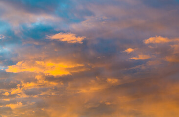 Naklejka na ściany i meble Beautiful clouds in the sunset sky