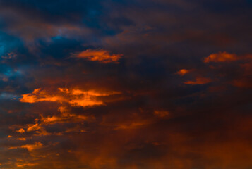 Naklejka na ściany i meble Beautiful sunset. Orange clouds in the sky (background)