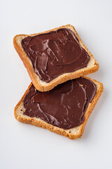 toasts with chocolate butter on a white acrylic background