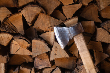 Woodpiles are freshly cut logs. A stack of tree trunks. Hit the chopped wood. Forestry. Ax. 