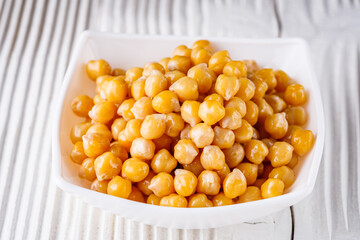 boiled chickpeas on a white wooden rustic background