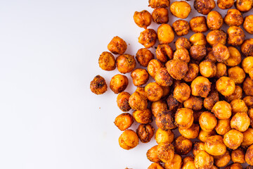 fried chickpeas on a white acrylic background