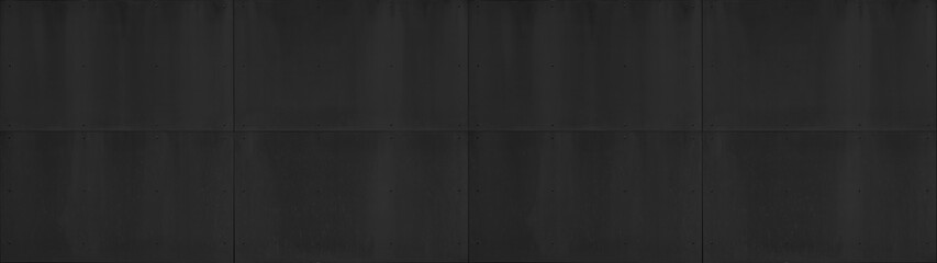 Black anthracite grunge dark wall with rivets, fiberglass concrete skin cement facade panels  texture background banner panorama