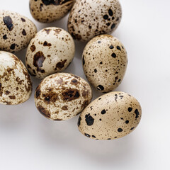 Obraz premium fresh quail eggs on a white acrylic background