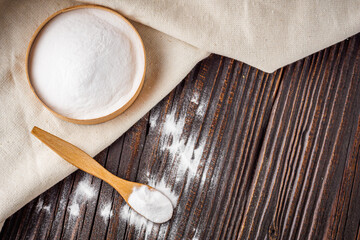baking soda powder on wooden rustic background background