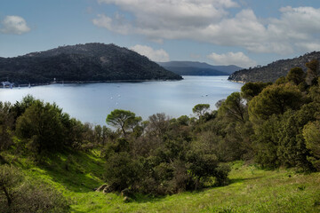 Pantano de San Juan on a sunny day with nice clouds. San Juan reservoir near Pelayos de la presa in Madrid