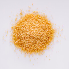cane brown sugar on a white acrylic background