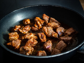 Veal nuggets in frying pan
