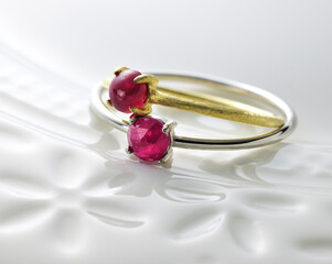 Jewelry accessories.ruby ring on white plate.