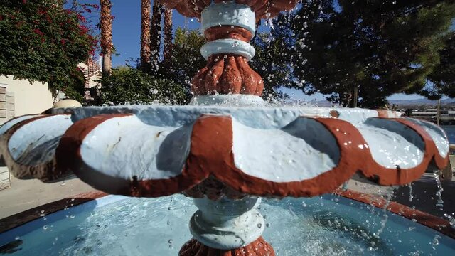 Vintage Style Fountain in Casino Hotel Resort, Laughlin, Nevada USA on Sunny Day Slow Motion Pedestal Shot
