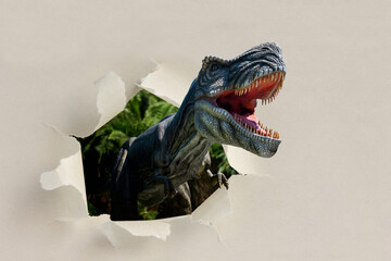 Closeup view of an angry T-Rex dinosaur figurine on black background