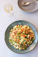 Couscous with vegetables and king prawns.