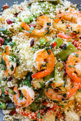 Couscous with vegetables and king prawns.