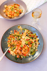 Couscous with vegetables and king prawns.