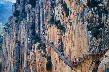 Very narrow path in rocky canyon - mountain wooden path along steep cliffs in Andalusia, Spain