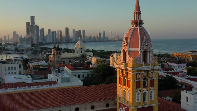 Drone Traveling out of Santa Catalina de Alejandr&iacute;a Cathedral in old city and Bocagrande of Cartagena de Indias, Colombia at the morning