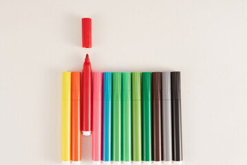 Colored markers on white background.