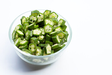 Fresh okra in glass bowl isolated on white