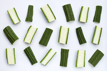 Fresh luffa vegetables on white background.