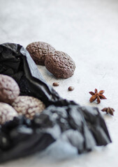 Chocolate chip cookies with coconut. Lie on a black and gray background.