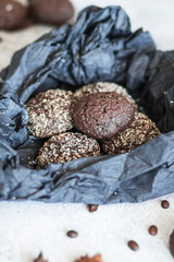 Chocolate chip cookies with coconut. Lie on a black and gray background.