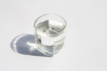 Glass of water on white background.