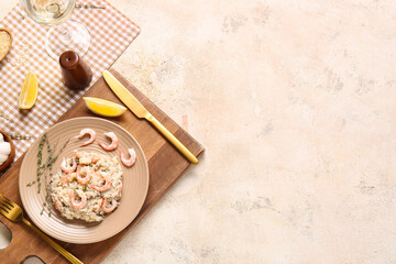 Plate with tasty risotto on light background