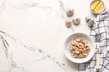 Plate with tasty risotto on light background