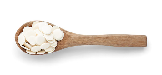 Spoon with chocolate drops on white background