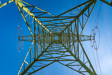High-Voltage electric tower at sky background.