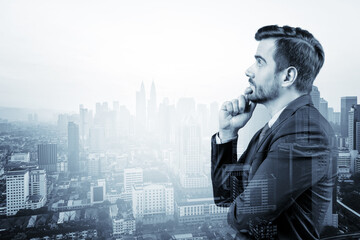 Young handsome businessman in suit with hand on chin thinking how to succeed, new career opportunities, MBA. Kuala Lumpur on background. Double exposure.