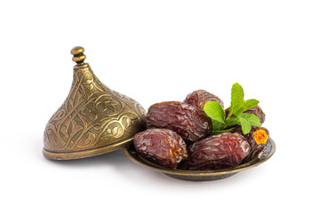 HURMA, Dates. Dried dates fruit with bronze bowls on white background. Popular fruit of Ramadan. .