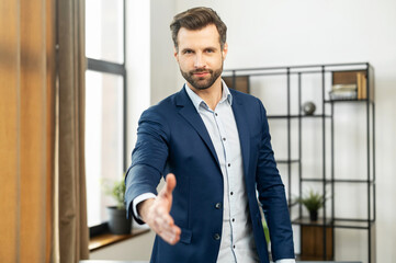 Confident businessman dressed in suit, handshake for teamwork of business merger and acquisition, successful negotiate, hand shake with partner to celebration partnership and business deal concept