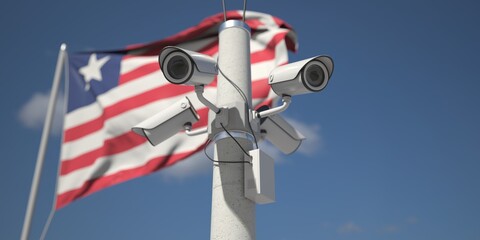 Waving flag of Liberia and the security cameras. 3d rendering