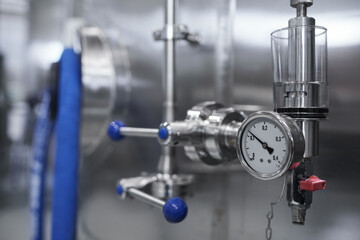 Closeup background image of pressure gauge on storage tank at industrial brewery workshop, copy space