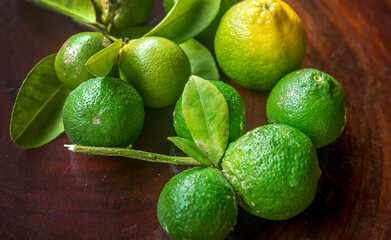 Fresh green eco Lime fruits with green leaf.