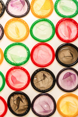 Naklejka premium Colorful condoms background.
