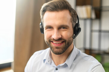 Handsome European man with dark brown hair, sparkling eyes, stubble, looking at camera, the best...