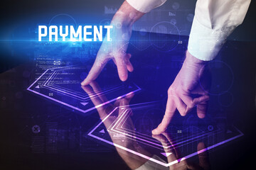Hand touching digital table with PAYMENT inscription, new age security concept