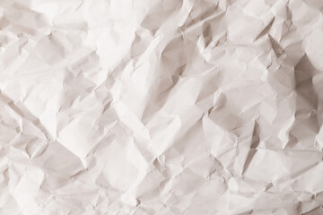 Crumpled white paper background.