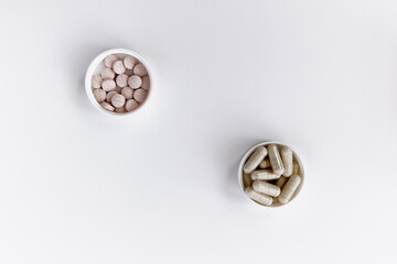 close-up of vitamin B-12 (methylcobalamin+dibencozide) chewable tablets and vitamin B6 (pyridoxal-5-phosphate) capsules. dietary concept. dietary supplement topview photo