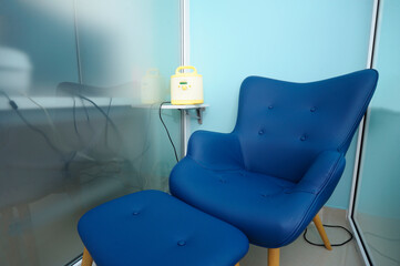 At the room for breast milk taking: chair and milk pump on a table
