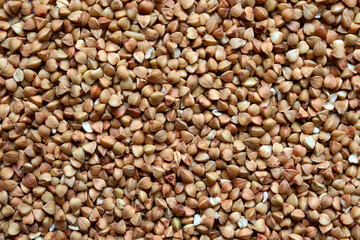 The texture of buckwheat. Background with buckwheat grains. Cereal. Healthy food.