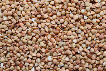 The texture of buckwheat. Background with buckwheat grains. Cereal. Healthy food.