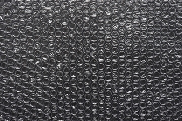 Bubble wrap texture. The film protects the surface from impact. Polyethylene.